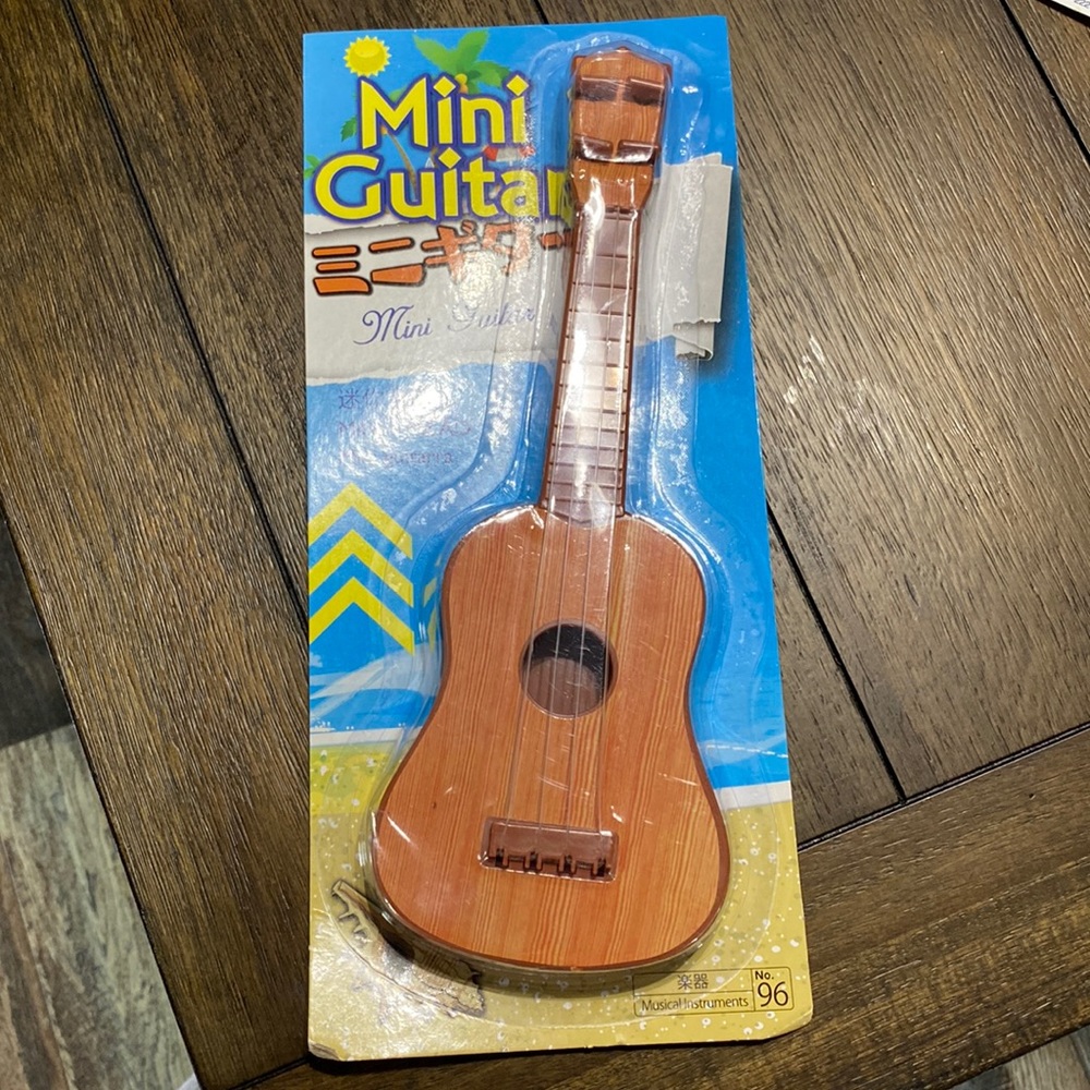 Cute mini guitar toy for kids small.